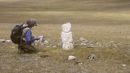 a person sitting a yellow prairie 