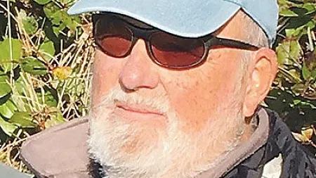 a person wearing a hat and sunglasses
