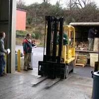 ELP 2001-2002 forklift unloading food from back of truck
