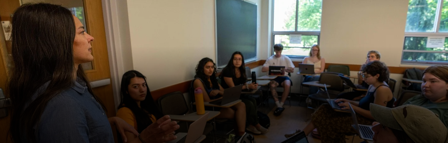 Instructor teaching in front of a classroom