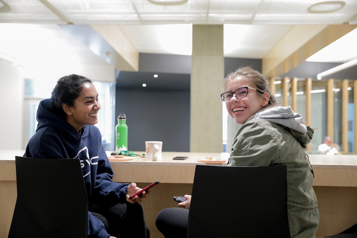 Two students sitting and talking together