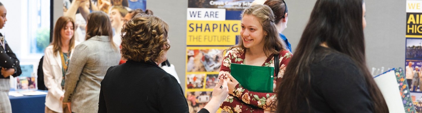 Education student is talking at the career fair