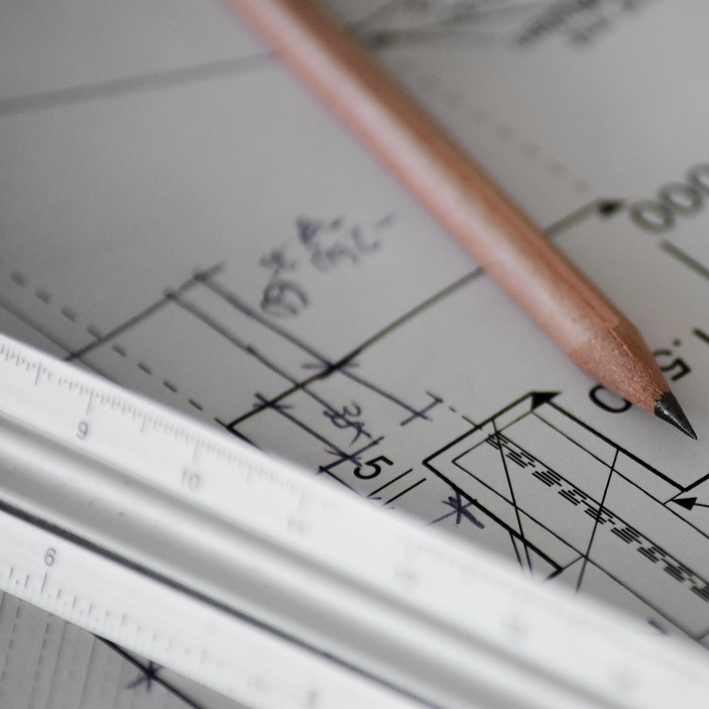 A pencil, ruler and schematic drawings
