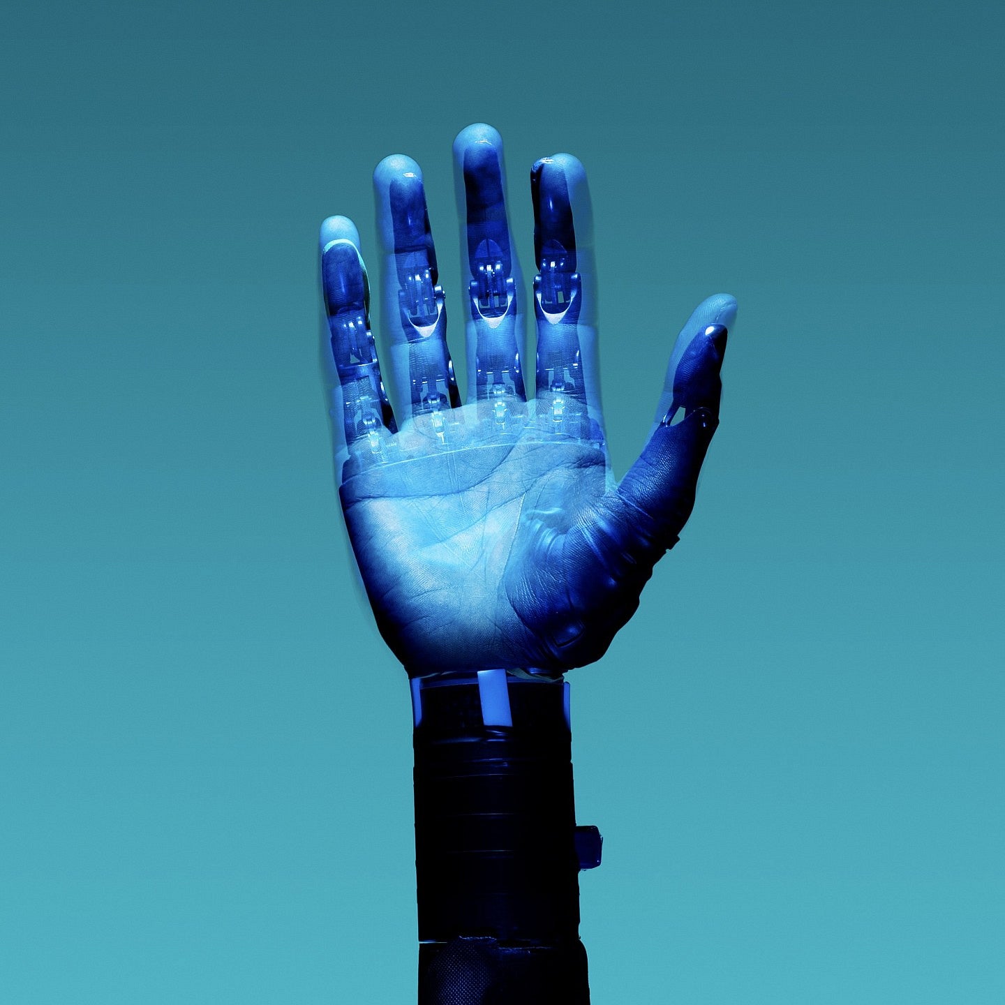 Human hand covered in a synthetic blue substance