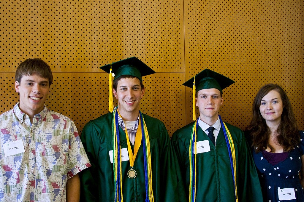 Four members of the 2012 Oregon Six smiling at the camera.