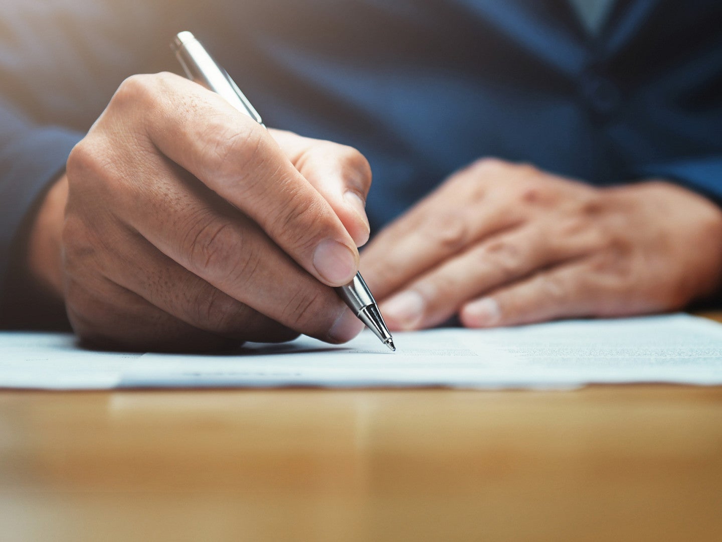 person writing letter