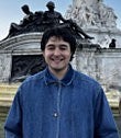 Matt Tuten has black hair and wears a blue shirt