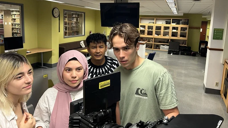 Film ARC students filming in a residence hall.