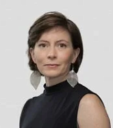 Maria Fernanda Escallón. She has short brown hair and large silver leaf earrings.