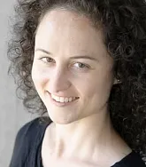 Caitlin Fausey.  She has thick curly brown hair.
