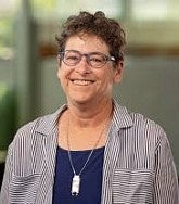 Judith Raiskin. She had short curly brown hair and glasses.
