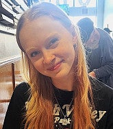 Emma Walker has long red hair