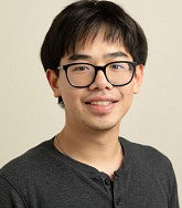 Hai Nguyen has black hair and glasses