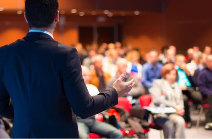 view from behind presenter at a presentation looking at the audience