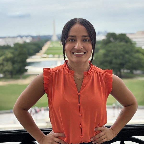 Wayne Morse Law Fellow Monica Parra with the Washington Monument in the background.