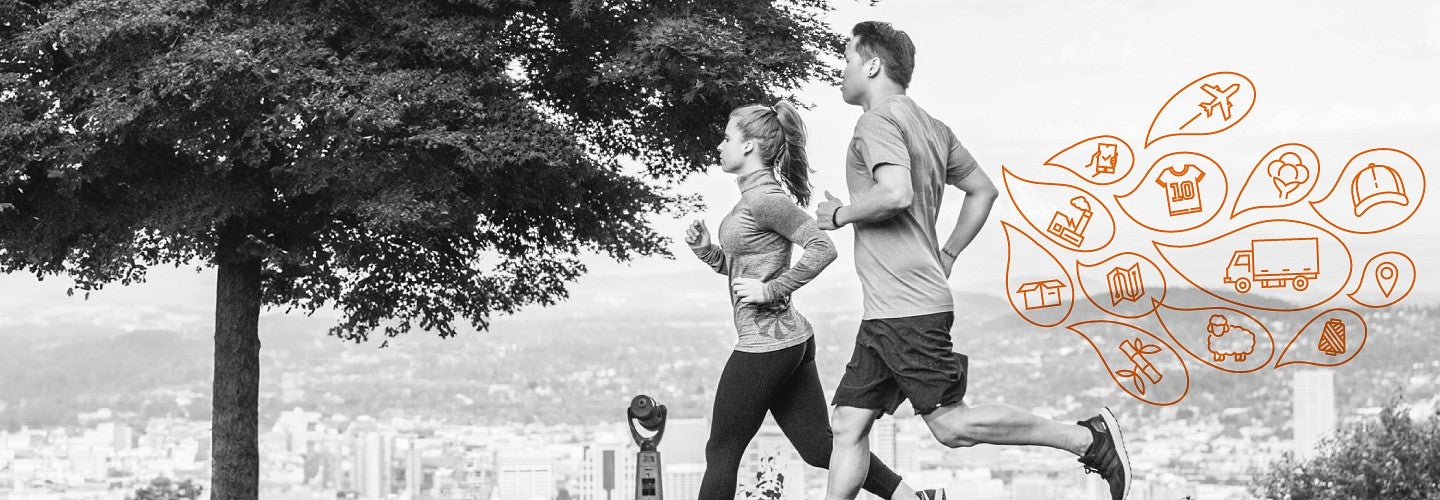A black-and-white photo of a man an a women running with the hills of Portland, Oregon visible in the background. Behinding the runners is a series of water droplet outline illustrations in orange with icons for various parts of the supply chain for sports products inside each droplet individually. The icons include a plane, cottom plant, bamboo stalk, map icons, shoe, a factory, a sheep, and a truck.