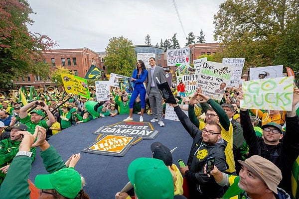 GameDay hosts during broadcast in front of Lillis Business Complex