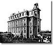 Historic photo of one of the first UO campus buildings with no trees around it