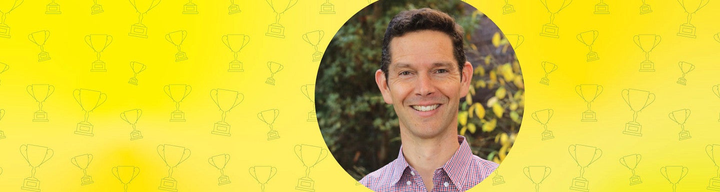 Head shot of Peter Younkin in a circle just off center to the right and on a yellow background with a grid of trophy icon line art
