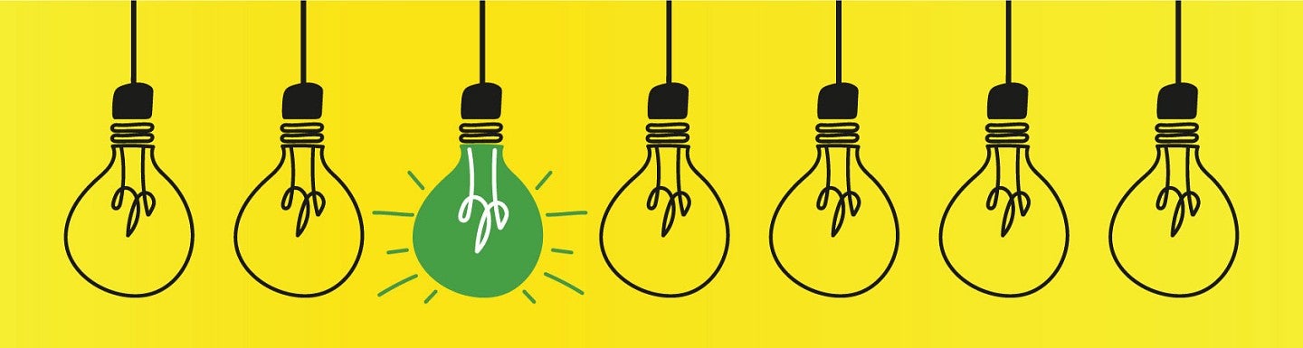Simple digital line art of a series of lightbulbs, one of which is solid green