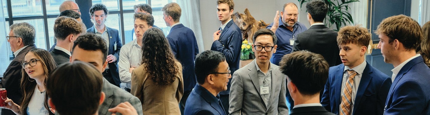 A crowd of students and industry professionals mingle at the UOREIG Networking Event