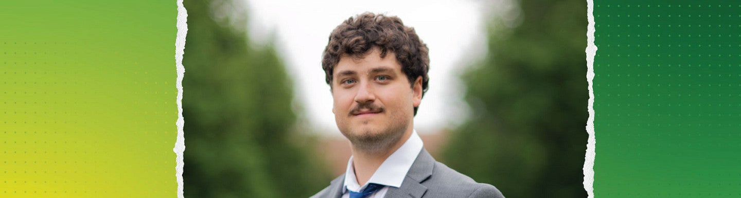 Young man with brown curly hair and a mustach smiles wearing a light gray suit, white shirt, and blue tie. portrait is overlaid on a green and yellow background. 