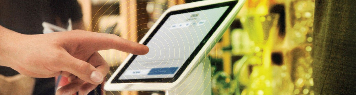 Close up photo of a customer entering information on a point of sale device