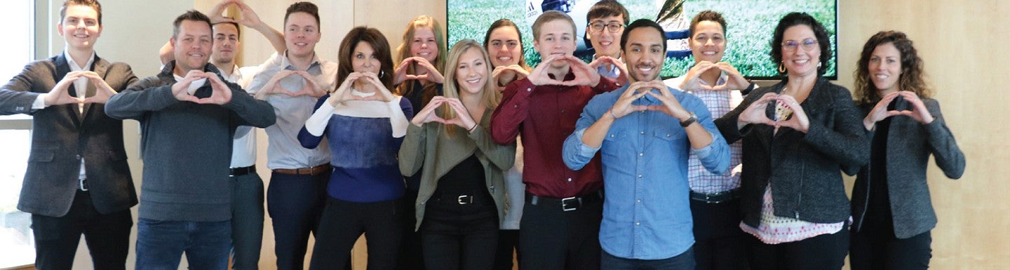 Students pose with FOX Sports executives