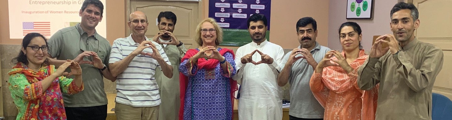 UO faculty throw the O alongside their KIU peers