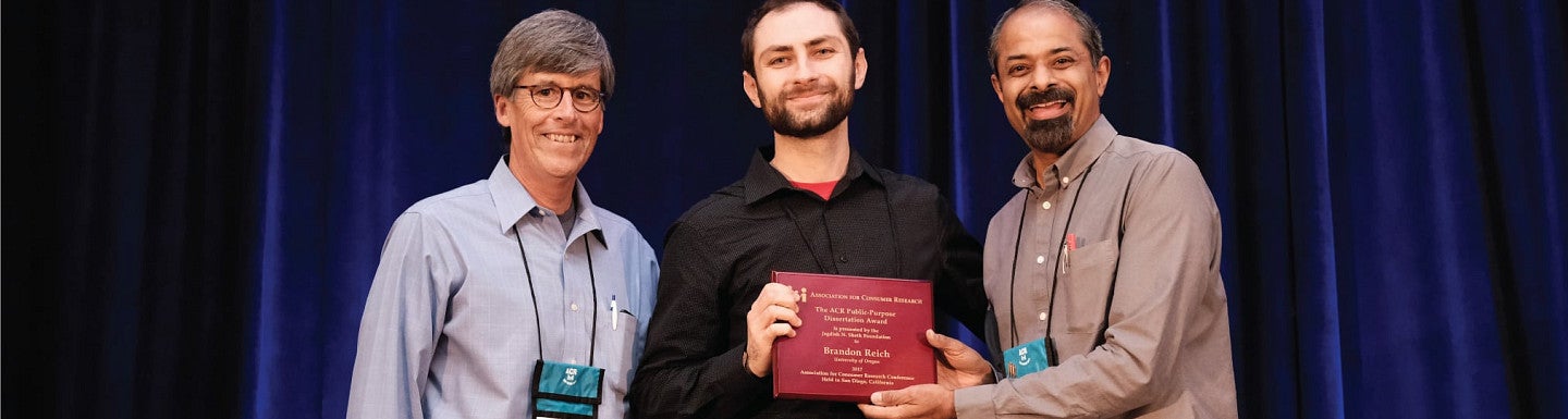 Brandon Reich receives his dissertation award