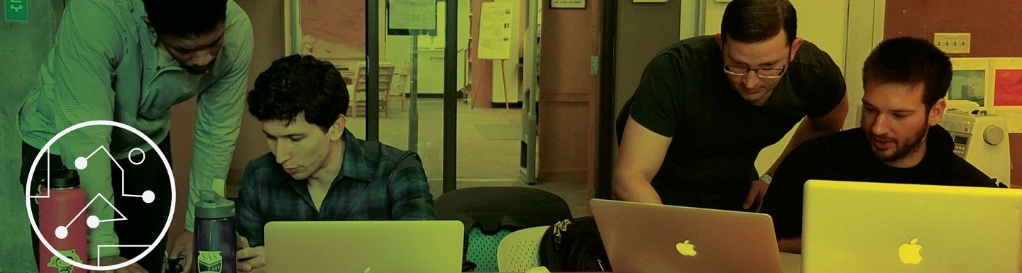 QuackCon participants work on their laptops