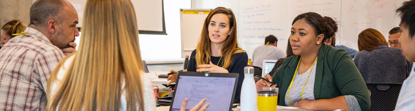Students discuss their work during a Sports Product Management workshop