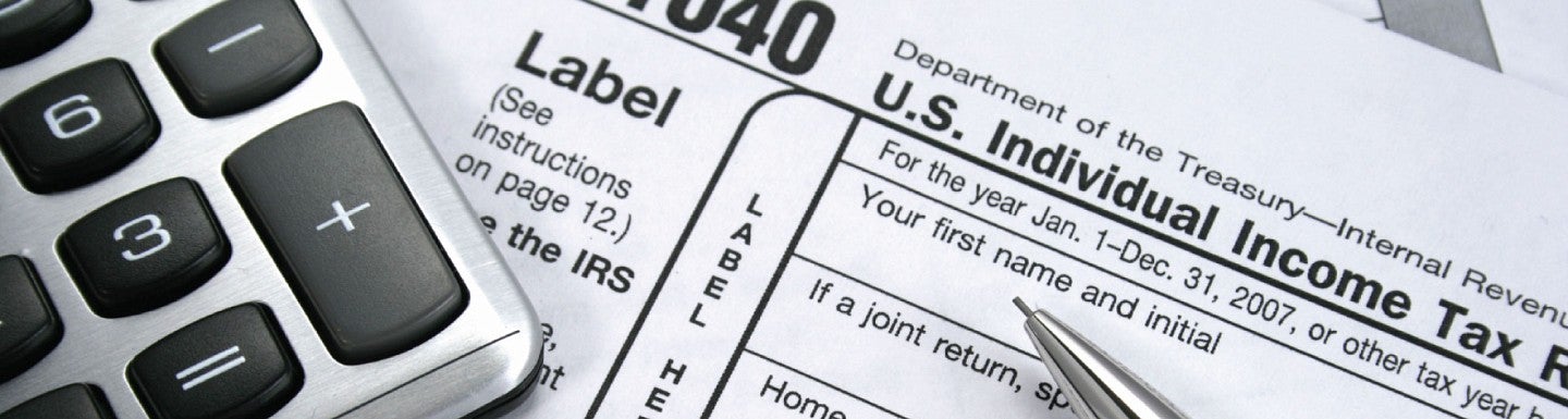 Image of taxes and a calculator