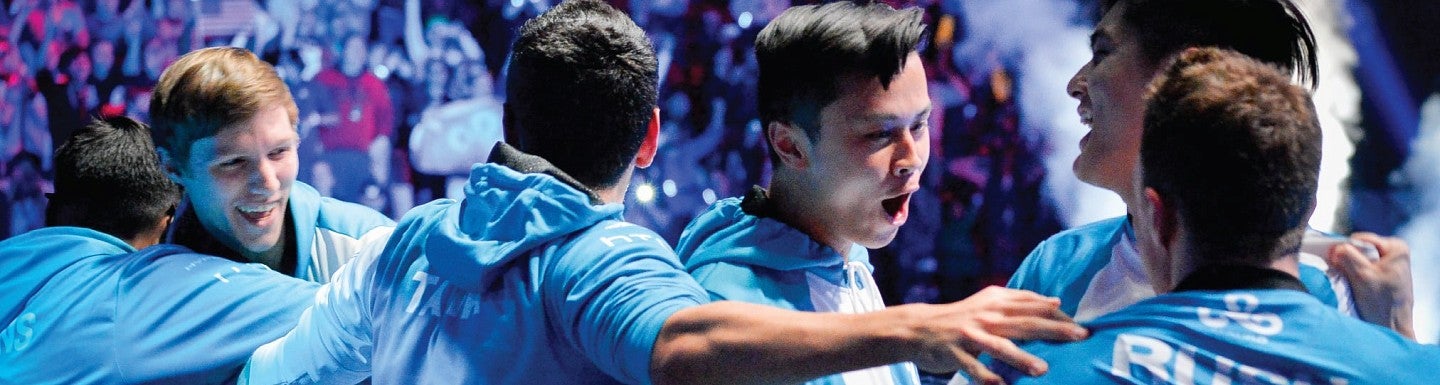 An esports team celebrates their win