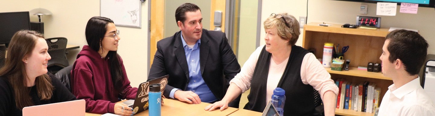Jared Barlow and Collette Niland chat with students