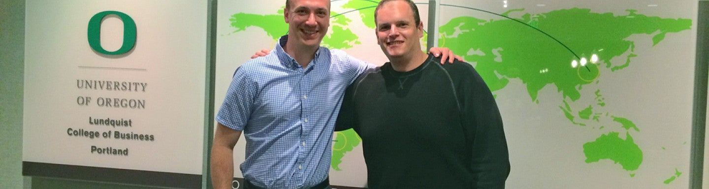 Andy Kalamaris and Nate Webb together in the Oregon Executive MBA office.