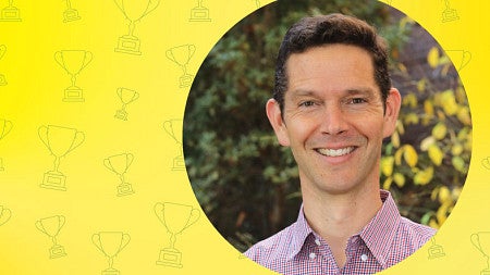 Head shot of Peter Younkin in a circle just off center to the right and on a yellow background with a grid of trophy icon line art