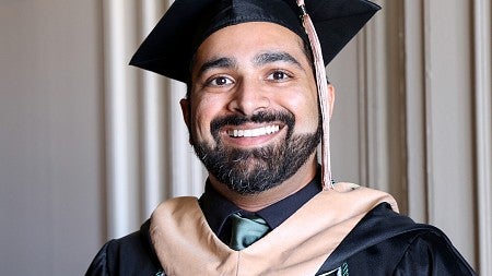Shan Rammah wearing commencement regalia