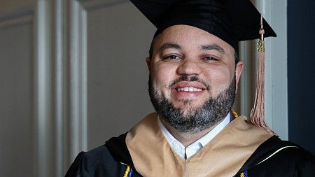 Jarryd Briggs, MBA '24, in commencement regalia.