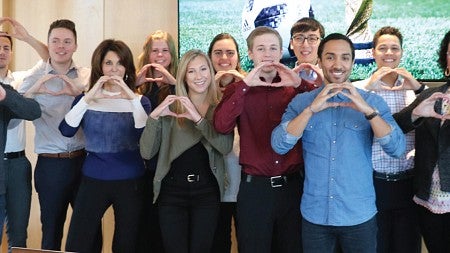 Students pose with FOX Sports executives