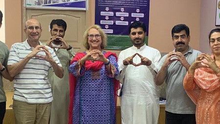 UO faculty throw the O alongside their KIU peers