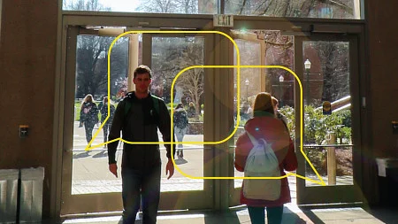 Students entering and exiting the Lillis Business Complex