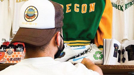 A store employee tends to a shelf of vintage products
