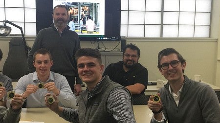 Student members of the Oregon Consulting Group at a site visit