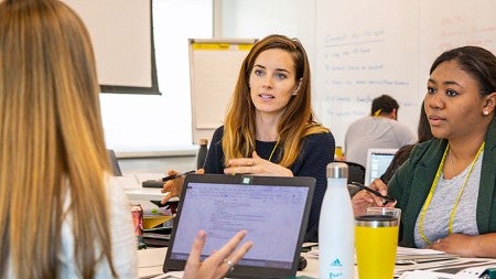 Students discuss their work during a Sports Product Management workshop