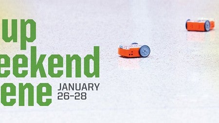 Startup Weekend Eugene title against background photo of tiny robots