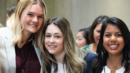 Women in Business club members pose for a photo