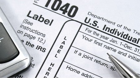 Image of taxes and a calculator