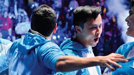 An esports team celebrates their win