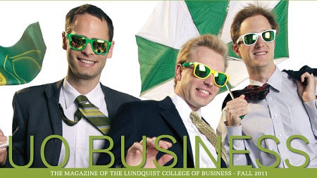 Three students wear sunglasses while being wind blown from the magazine cover